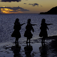 Hula dancers silouhette on One Ali'i Beach